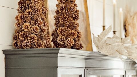 Pinecone trees on top of black dining room hutch