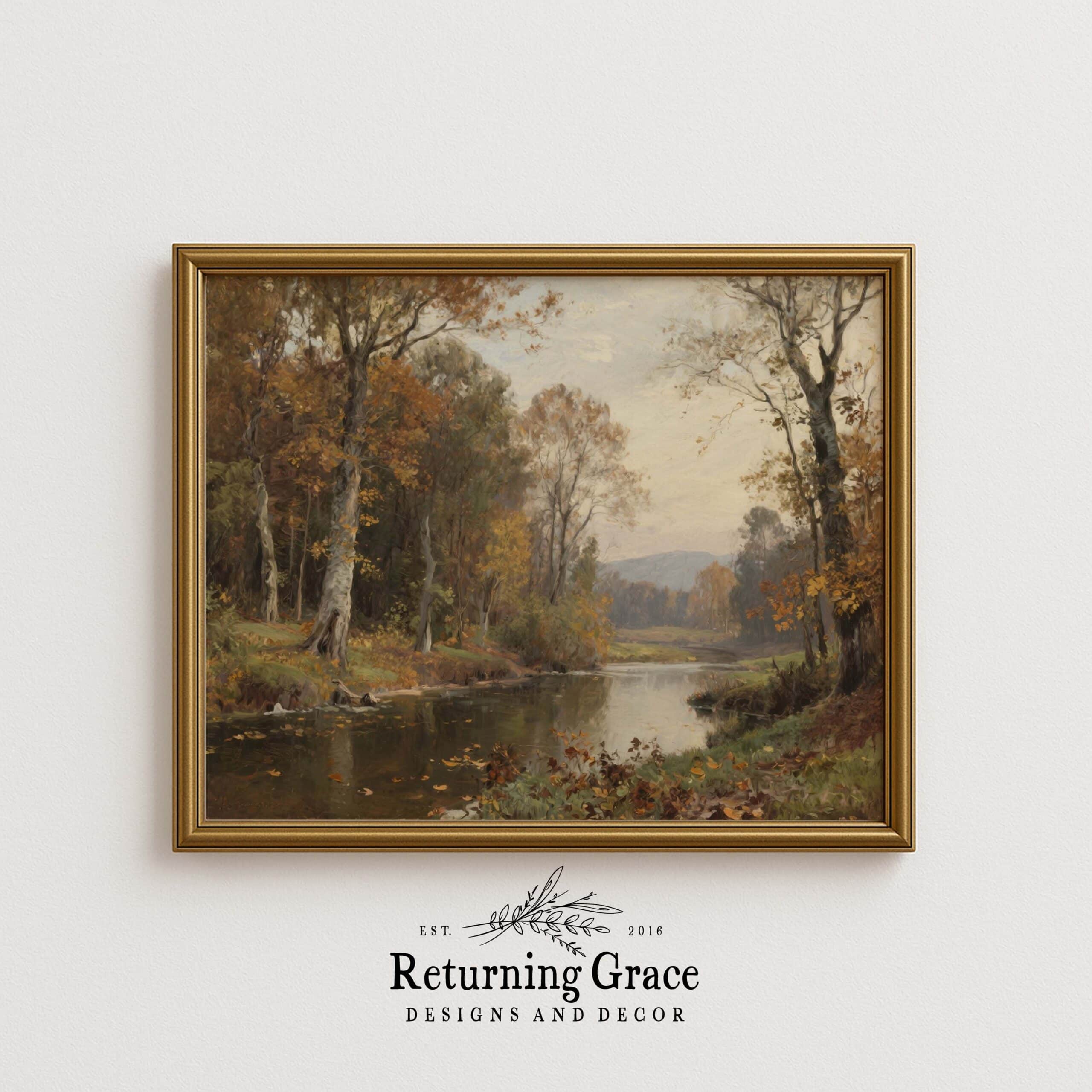 A framed painting of a tranquil river flowing through an autumn forest, with tall trees and colorful foliage, hangs on a white wall above the Returning Grace Designs and Decor logo.